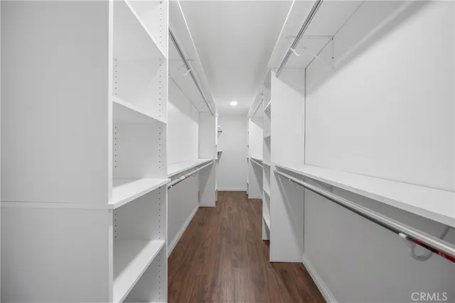 a view of hallway with wooden floor