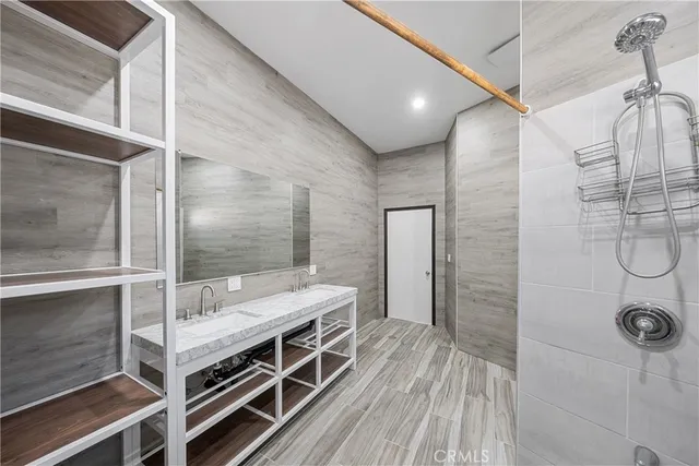 a bathroom with a double vanity sink and a mirror