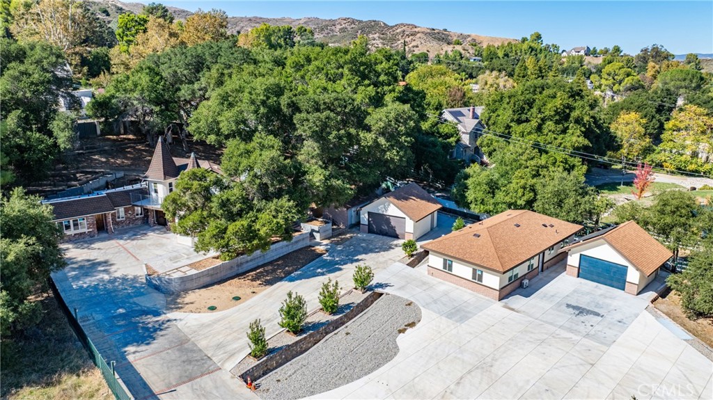 26251 Ravenhill Road Canyon Country, CA 91387 - Photo 2 of 64 an aerial view of a house with a yard