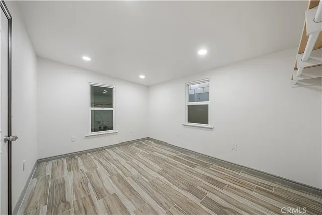 a bathroom with a sink a toilet a mirror and shower