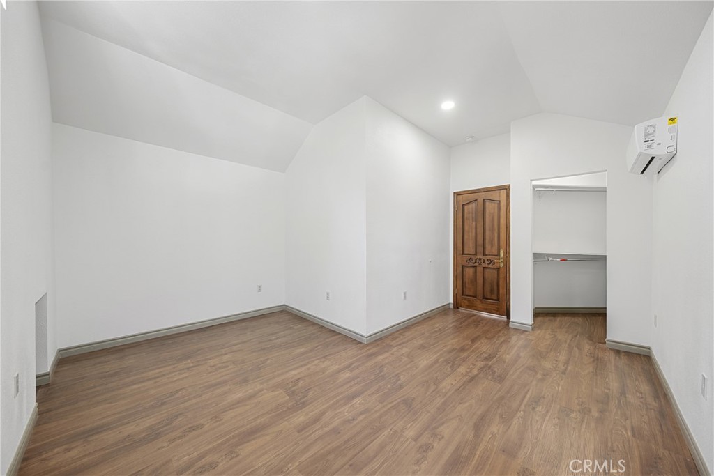 26251 Ravenhill Road Canyon Country, CA 91387 - Photo 26 of 64 a view of an empty room with wooden floor and closet