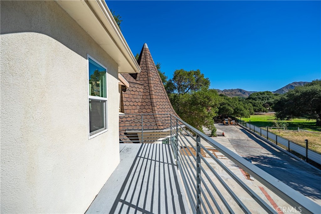 26251 Ravenhill Road Canyon Country, CA 91387 - Photo 30 of 64 a view of balcony with wooden floor and fence