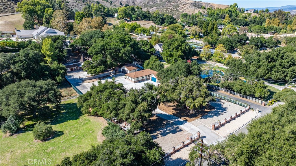 26251 Ravenhill Road Canyon Country, CA 91387 - Photo 32 of 64 an aerial view of residential house with outdoor space and trees all around