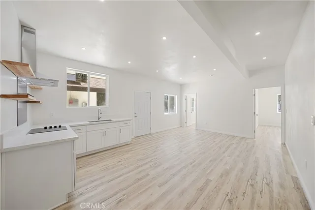 a view of a kitchen with wooden floor