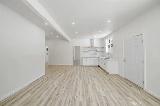 a view of a lush green hillside and a houses