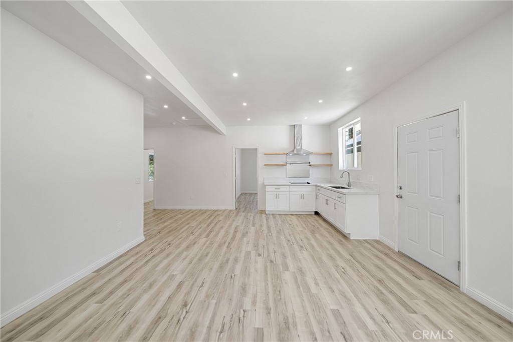 26251 Ravenhill Road Canyon Country, CA 91387 - Photo 37 of 64 a view of a kitchen with wooden floor