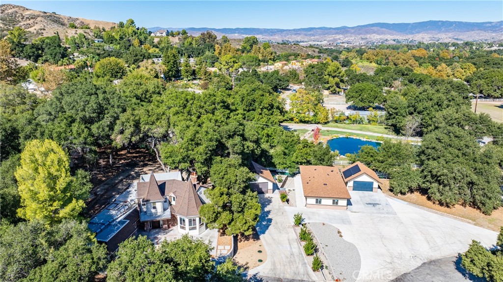 26251 Ravenhill Road Canyon Country, CA 91387 - Photo 41 of 64 an aerial view of a house with a yard