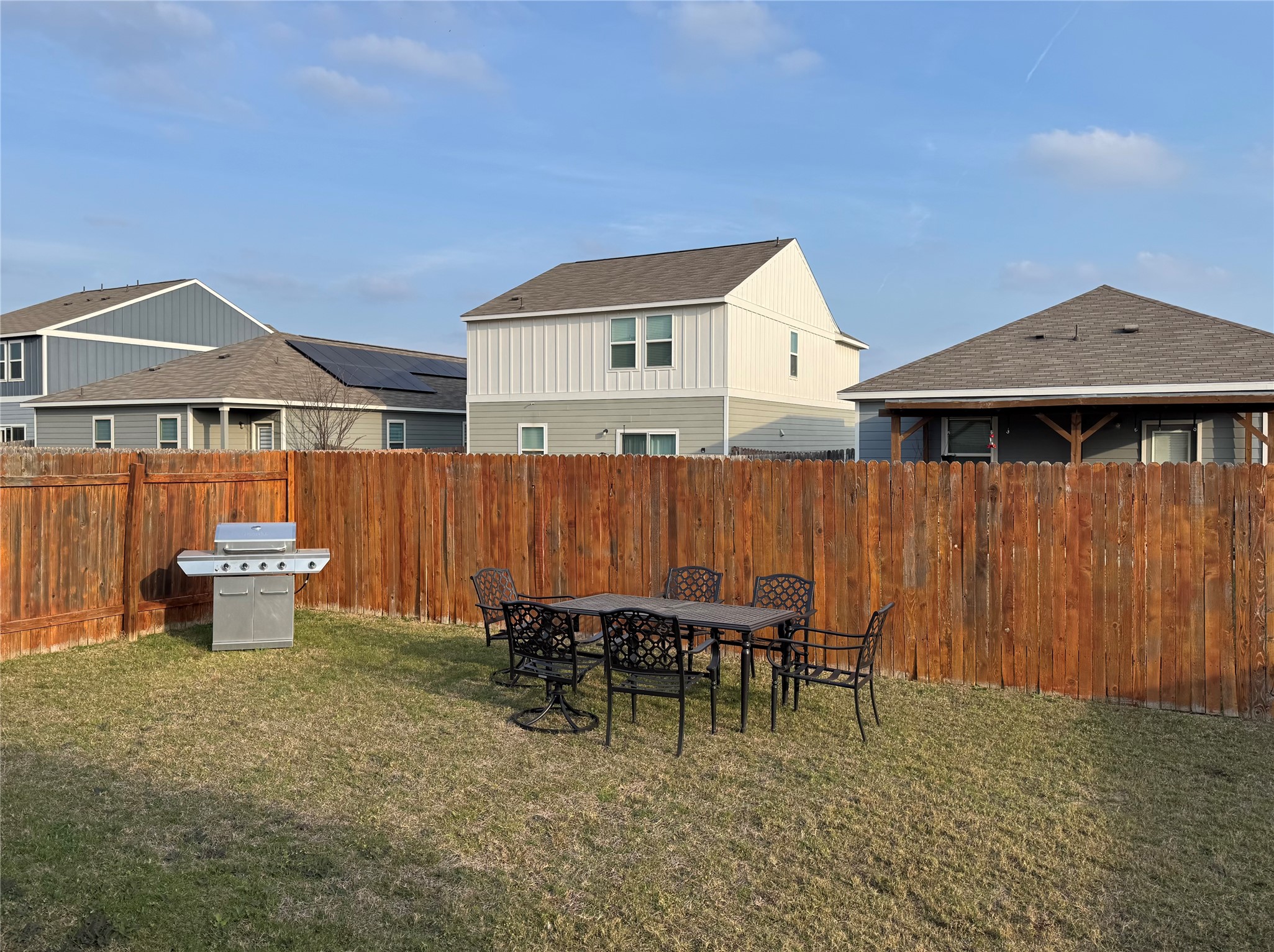 13017 Foreston Drive Austin, TX 78754 - Photo 11 of 12 a view of a patio with table and chairs with wooden fence