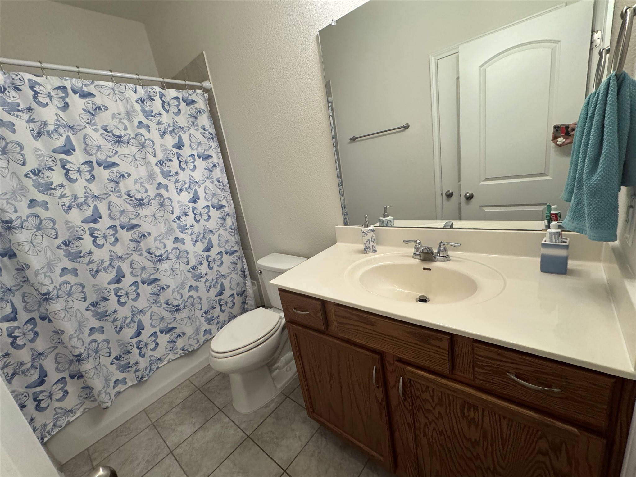 13017 Foreston Drive Austin, TX 78754 - Photo 10 of 12 a bathroom with a sink and a mirror