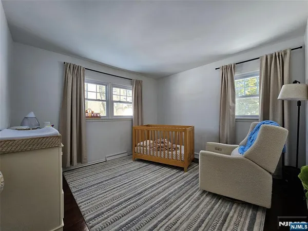 a bedroom with furniture and windows