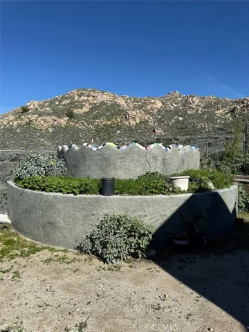 a view of a outdoor space with mountain view in the back