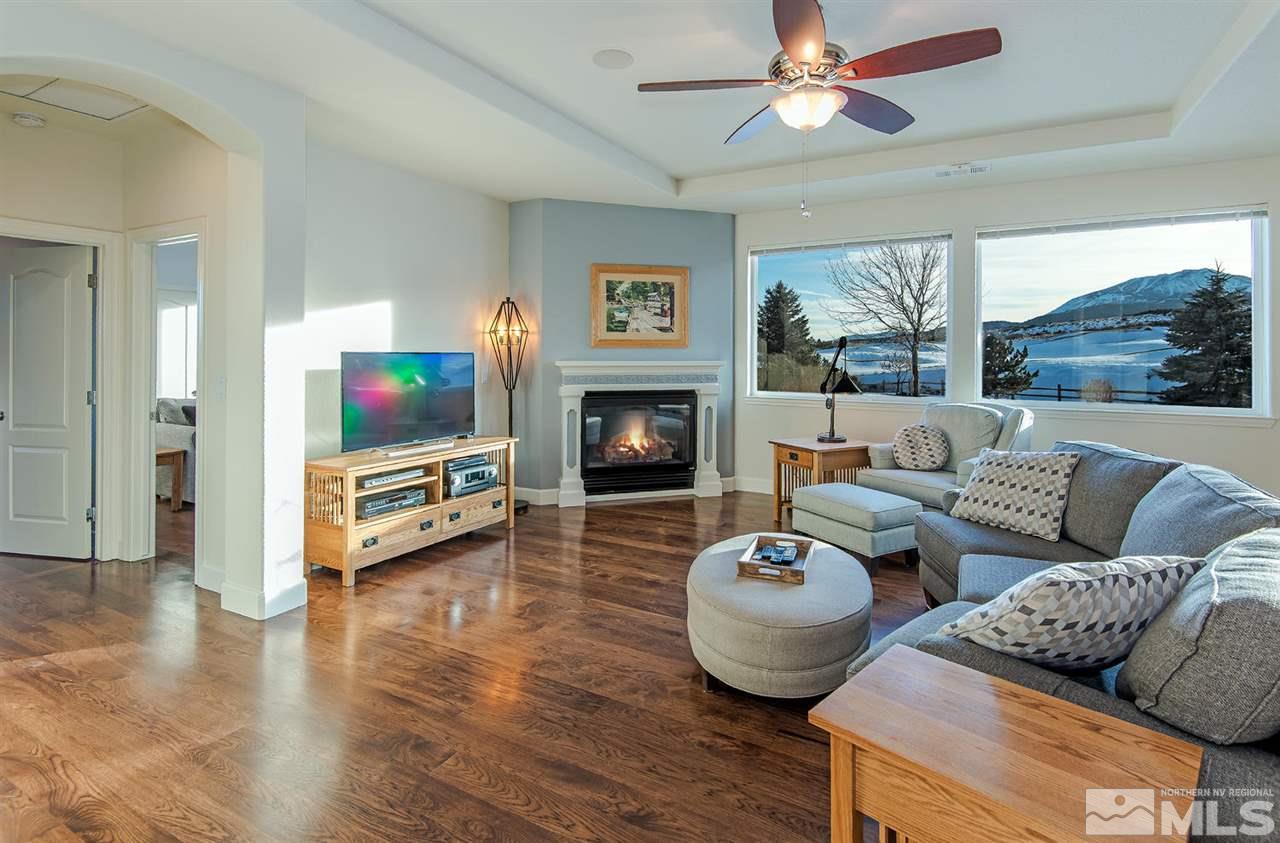 6965 Cour Street Reno, NV 89511 - Photo 13 of 25 a living room with furniture a fireplace and a flat screen tv