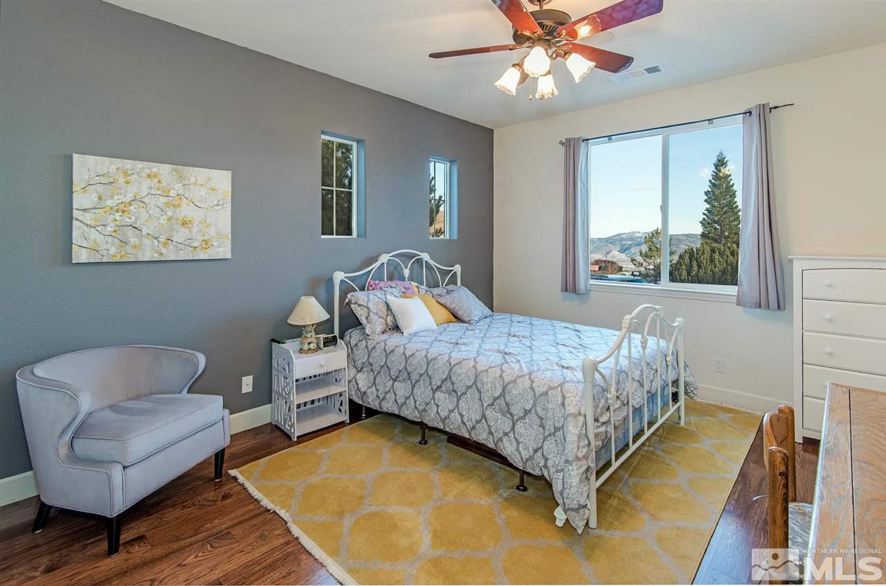 6965 Cour Street Reno, NV 89511 - Photo 15 of 25 a bedroom with a bed and a couch