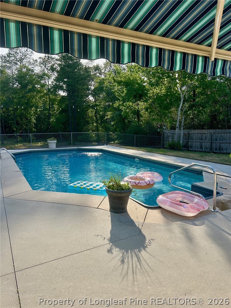 930 Old Vander Road Fayetteville, NC 28312 - Photo 42 of 45 a view of a swimming pool with a patio