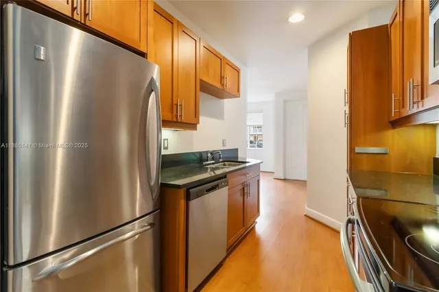 a kitchen that has a sink and a stove