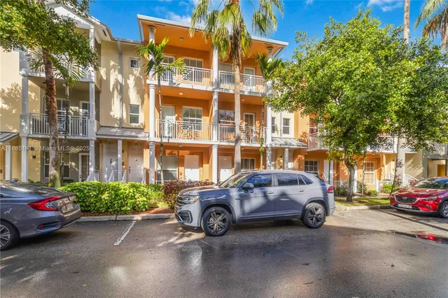 a view of a cars parked in front of a building
