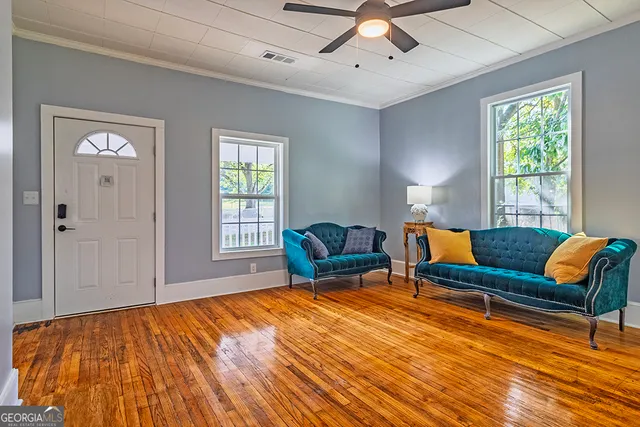 a living room with furniture and a window