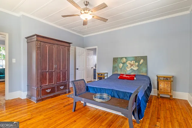 a bedroom with a bed and a table in it