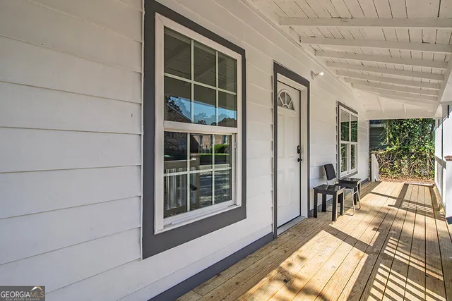 a view of balcony and wooden floor