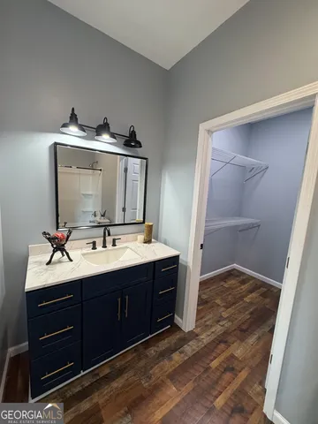 a bathroom with a sink and mirror