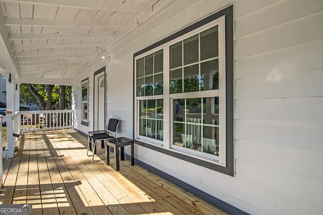 a view of a balcony with a large window