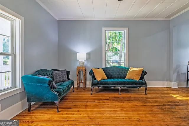 a living room with furniture and windows
