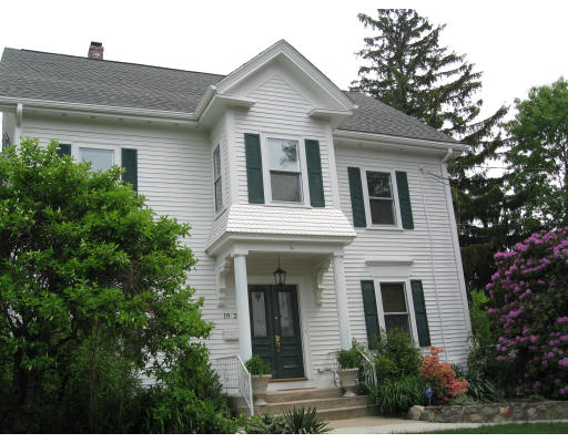 19 Stow Street, Unit 2 Waltham, MA 02453 - Photo 1 of 1 a front view of a house with plants and trees