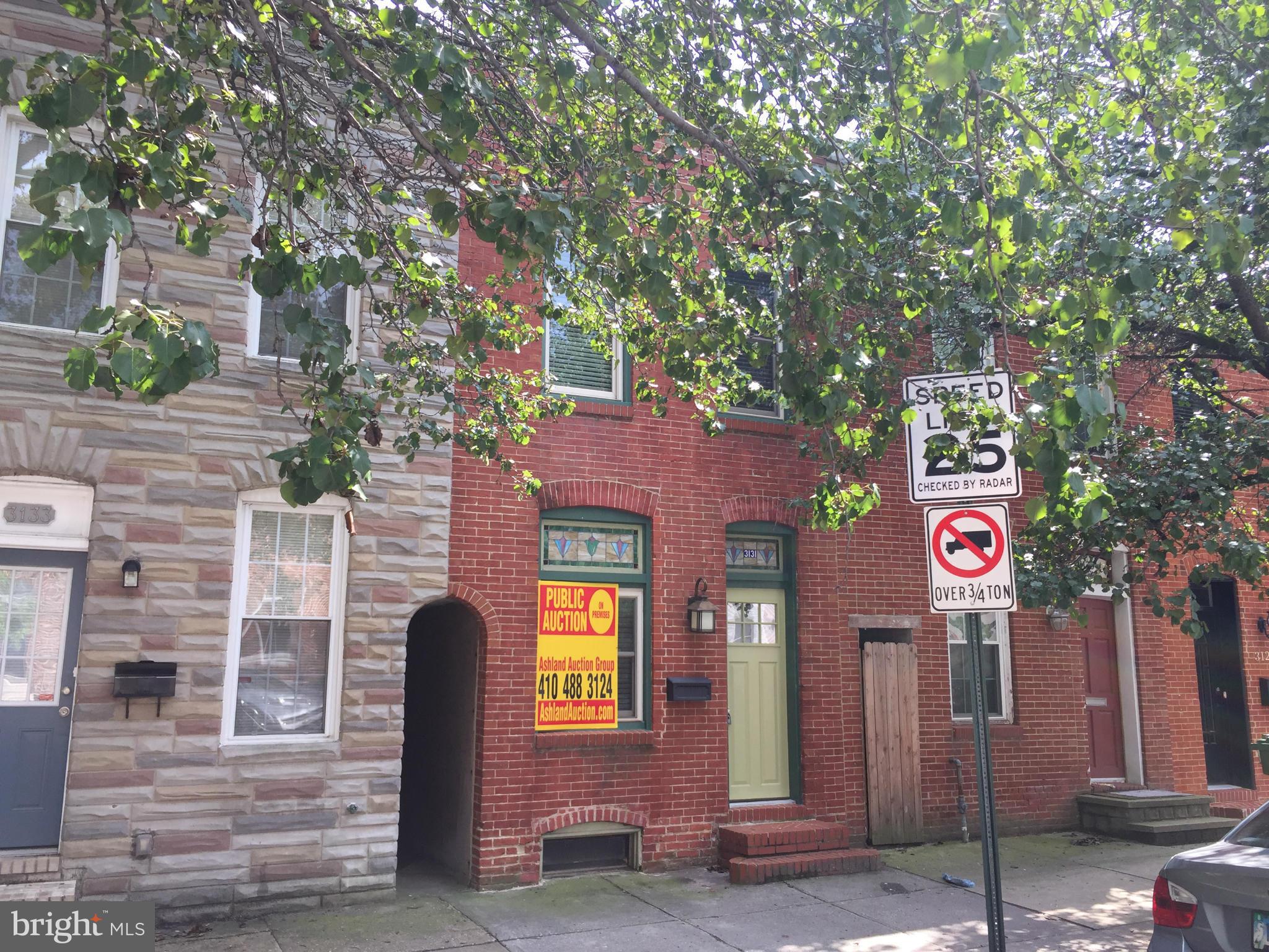 3131 Elliott Street Baltimore, MD 21224 - Photo 1 of 14 a front view of a building with street view