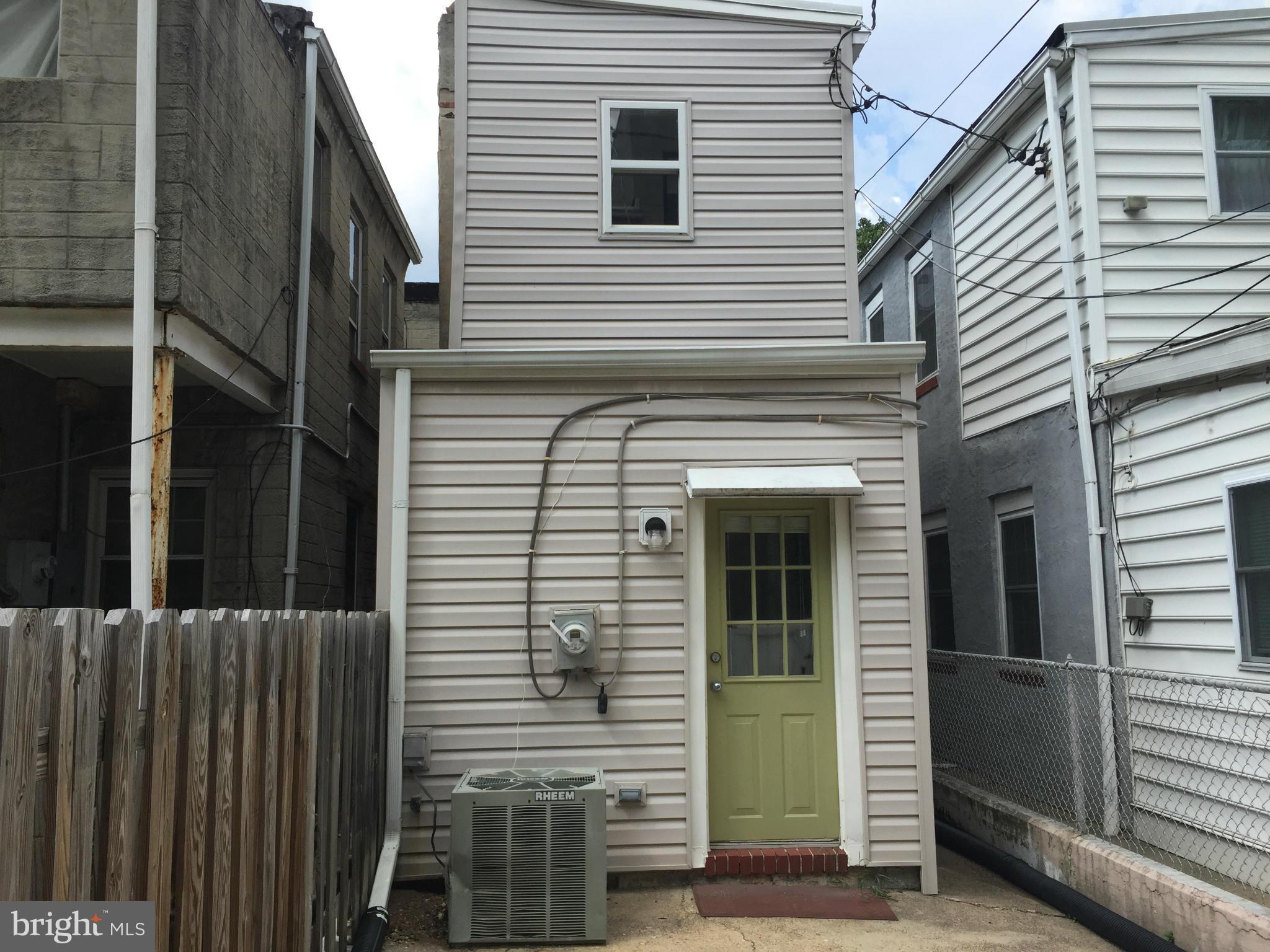 3131 Elliott Street Baltimore, MD 21224 - Photo 2 of 14 a view of a house with a door and a window