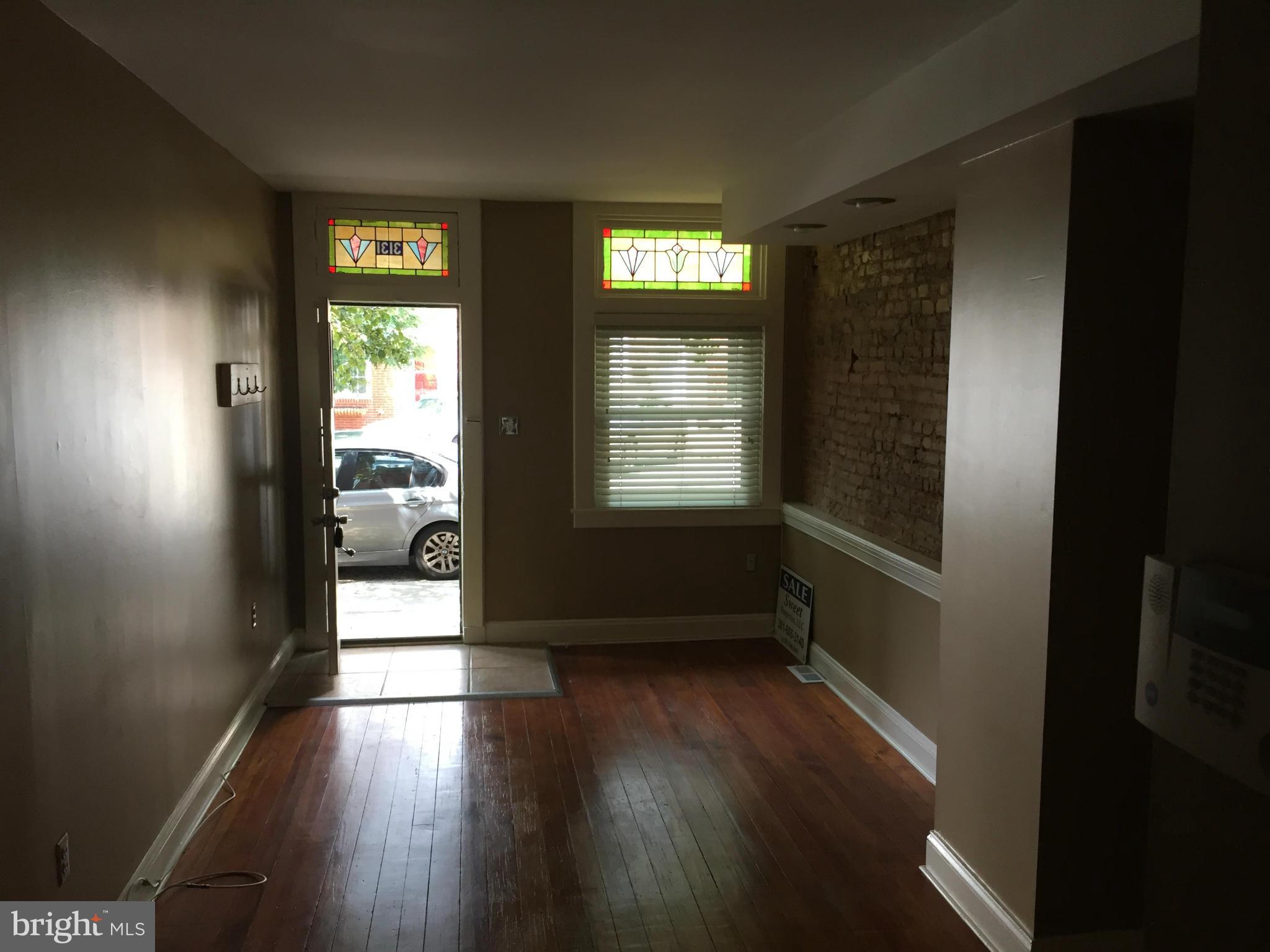 3131 Elliott Street Baltimore, MD 21224 - Photo 3 of 14 a view of hallway with wooden floor
