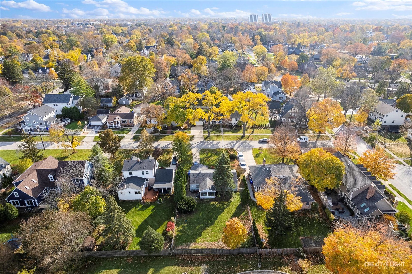 325 West Prairie Avenue Wheaton, IL 60187 - Photo 5 of 8 an aerial view of residential houses with outdoor space and swimming pool