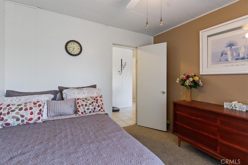 300 North Rampart Street, Unit 195 Orange, CA 92868 - Photo 17 of 25 a bedroom with bed and cabinets