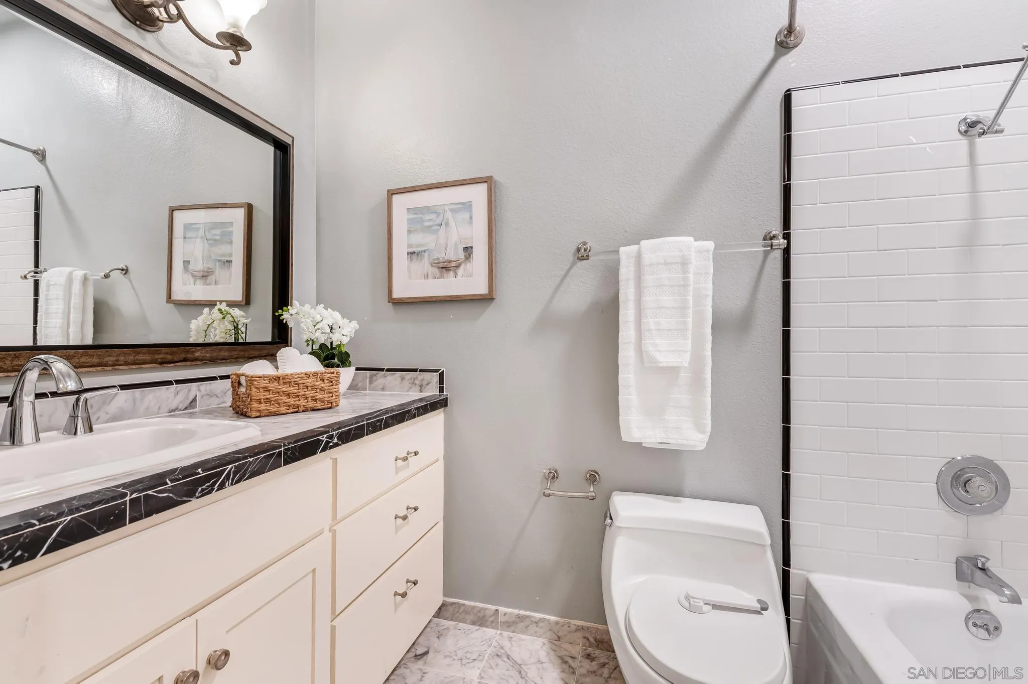 5370 La Jolla Boulevard, Unit 201B La Jolla, CA 92037 - Photo 18 of 31 a bathroom with a granite countertop sink toilet and mirror