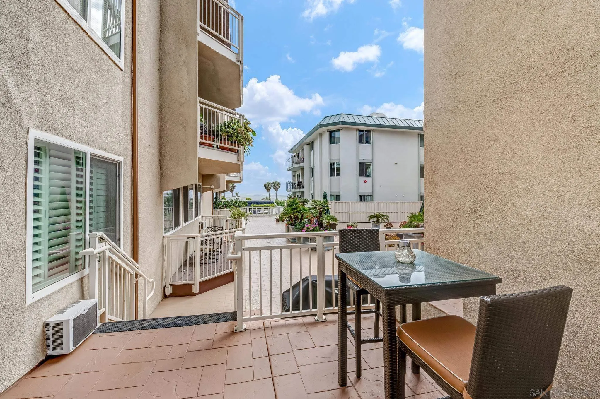 5370 La Jolla Boulevard, Unit 201B La Jolla, CA 92037 - Photo 24 of 31 a view of a patio with table and chairs