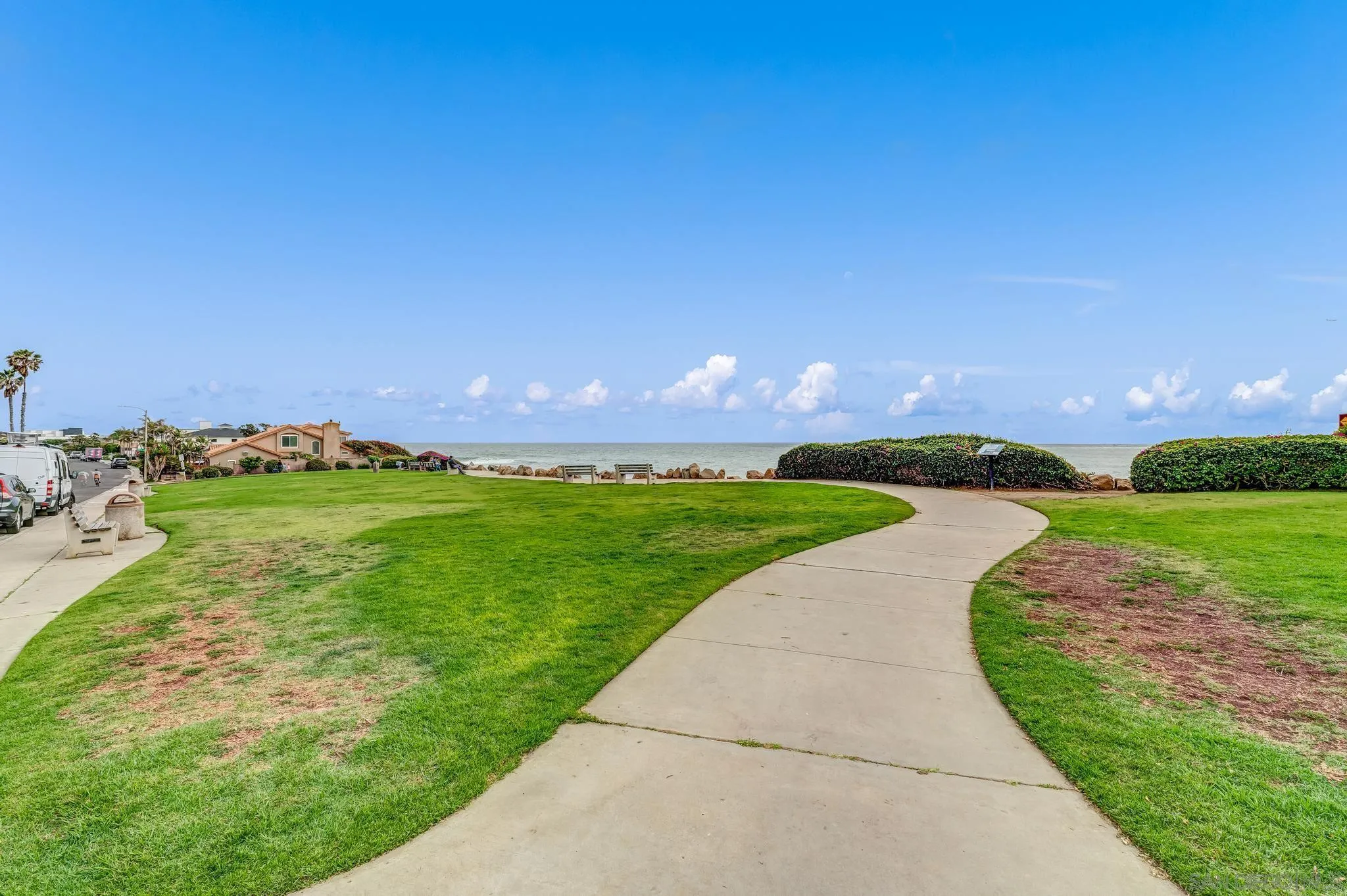 5370 La Jolla Boulevard, Unit 201B La Jolla, CA 92037 - Photo 30 of 31 a view of a garden with an buildings in the background