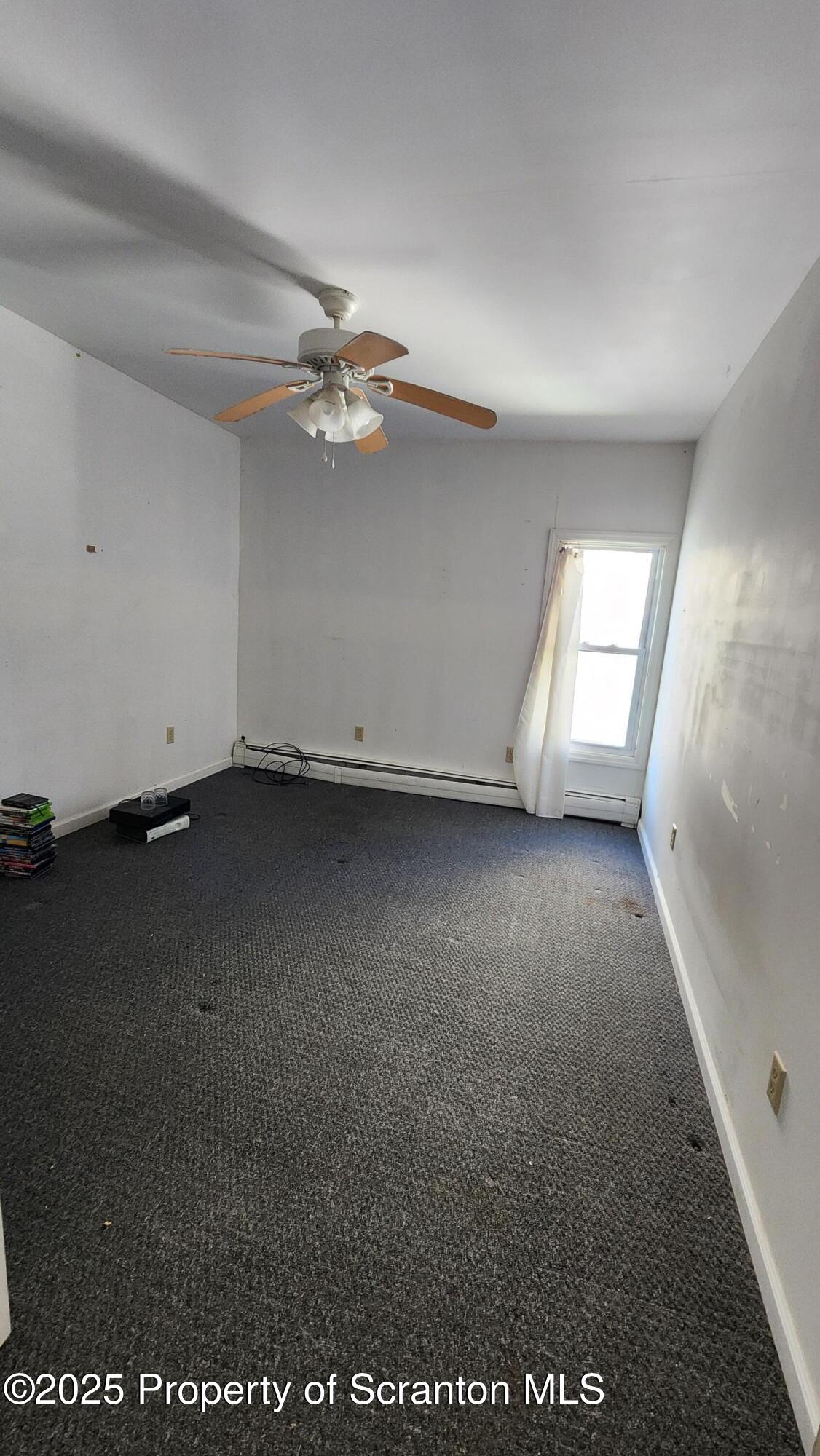 40 William Street Hallstead, PA 18822 - Photo 12 of 31 wooden floor in an empty room with a window