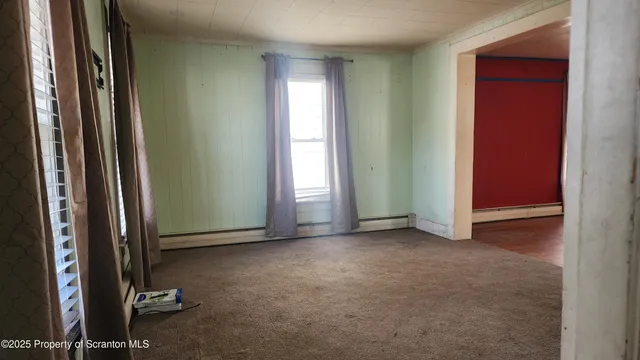 an empty room with windows