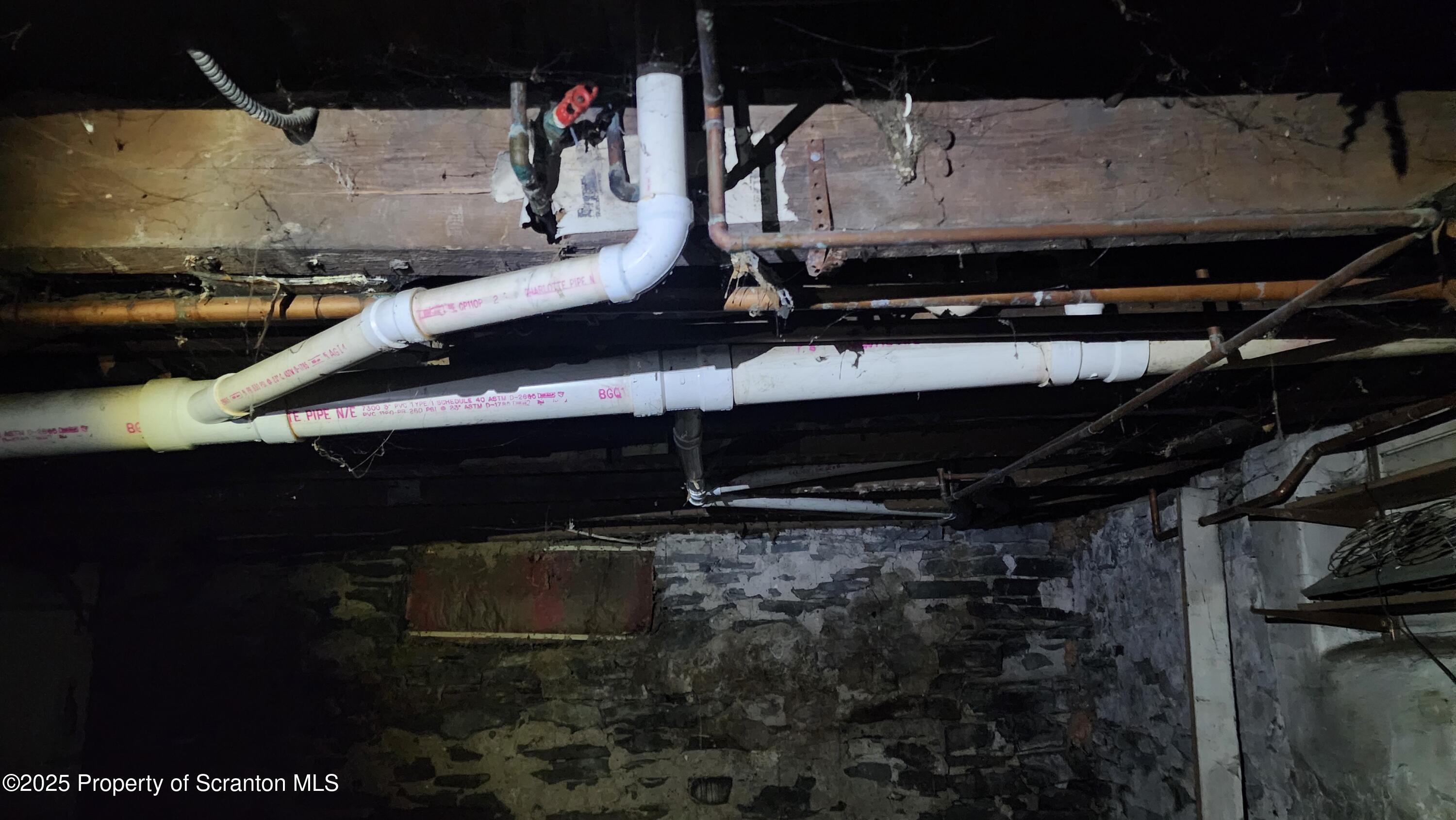 40 William Street Hallstead, PA 18822 - Photo 24 of 31 a room with water heater and wooden cabinets