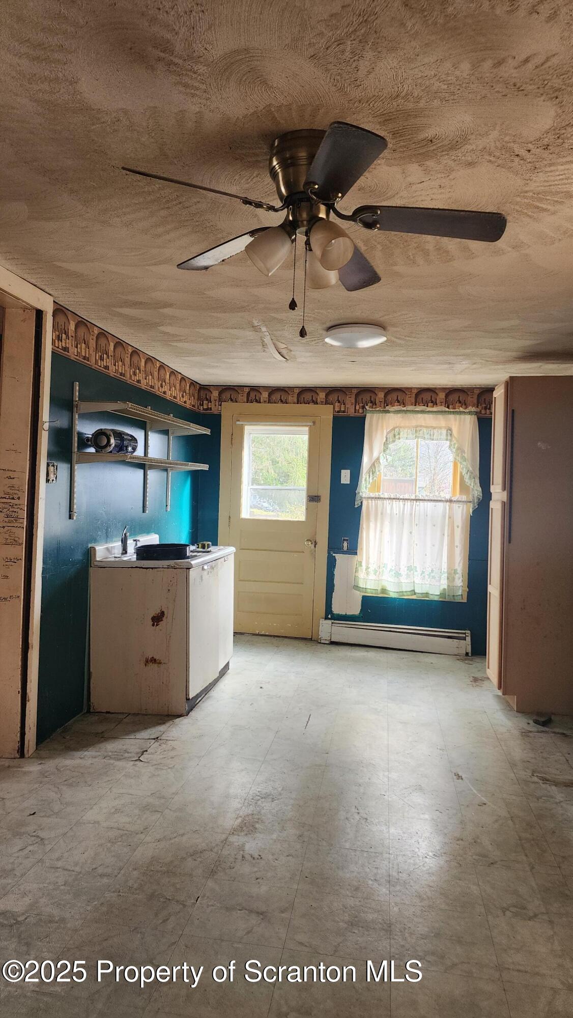 40 William Street Hallstead, PA 18822 - Photo 4 of 31 a view of a kitchen with a sink and cabinet area