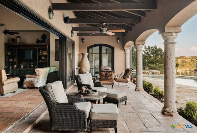 a view of a swimming pool with a patio