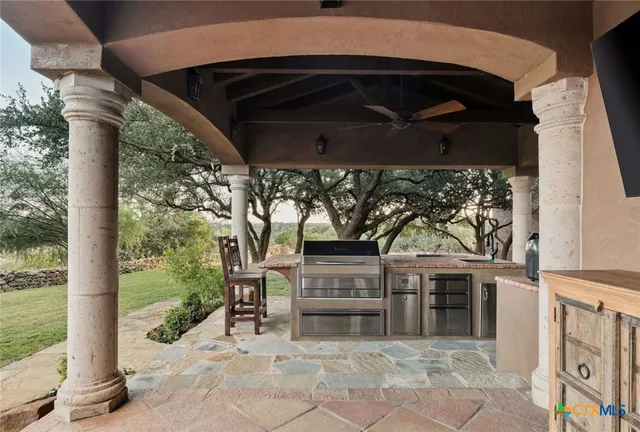 a living room with furniture fireplace and a large window