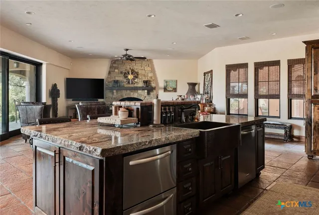 a stove top oven sitting inside of a kitchen