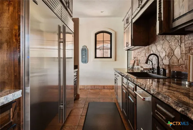 a view of hall way with furniture