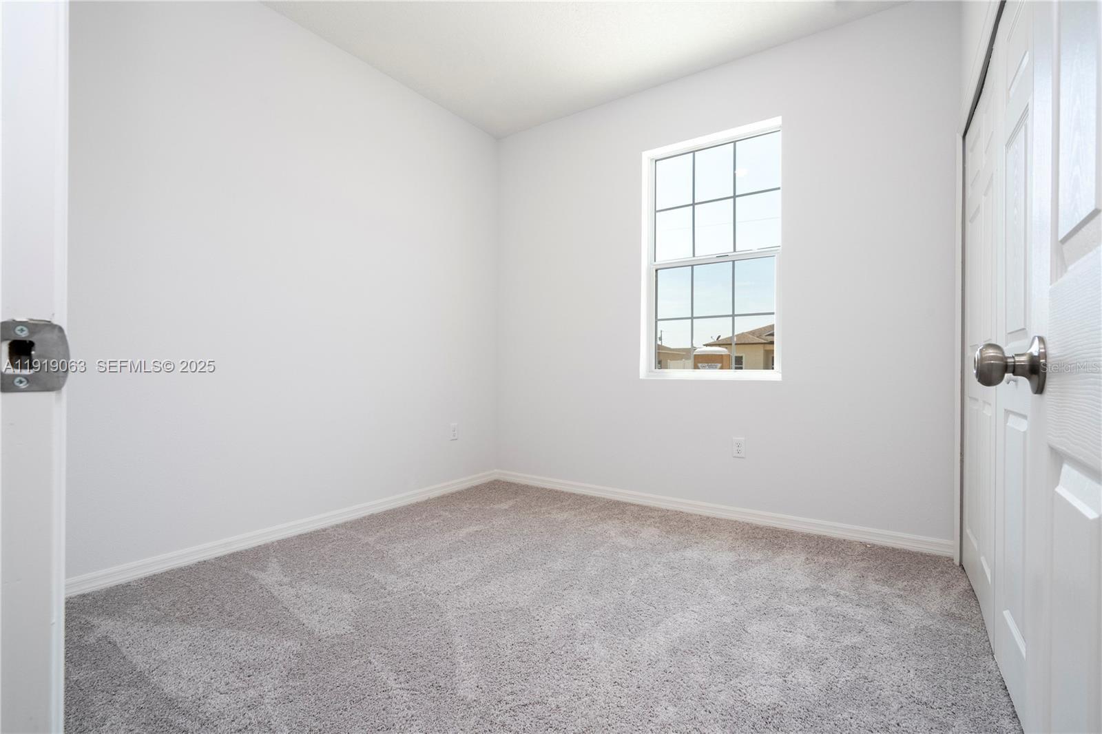 833 Colville Drive, Unit 833 Kissimmee, FL 34759 - Photo 37 of 47 an empty room with windows