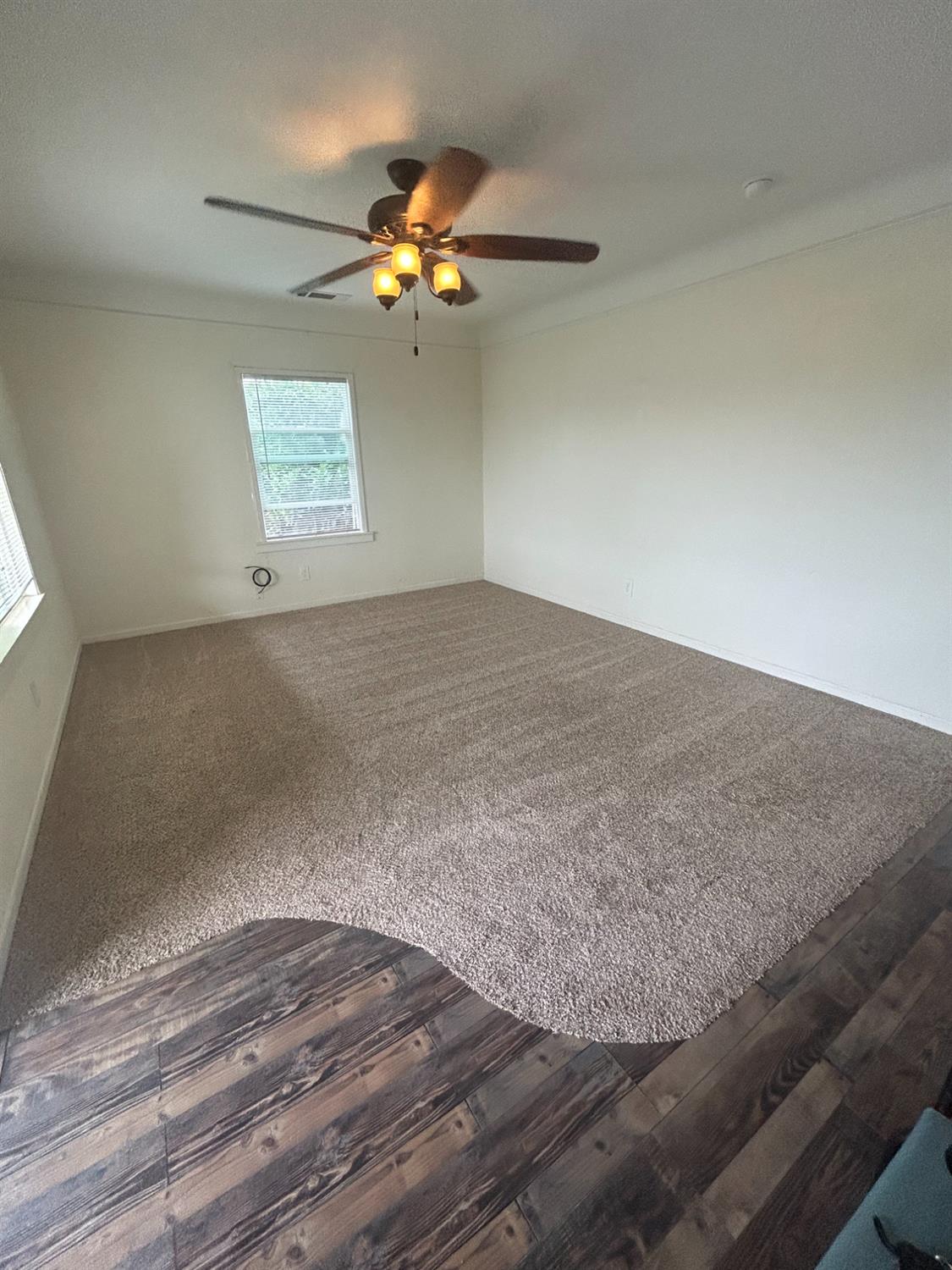 313 East Sacramento Street Coalinga, CA 93210 - Photo 6 of 23 a view of empty room with window