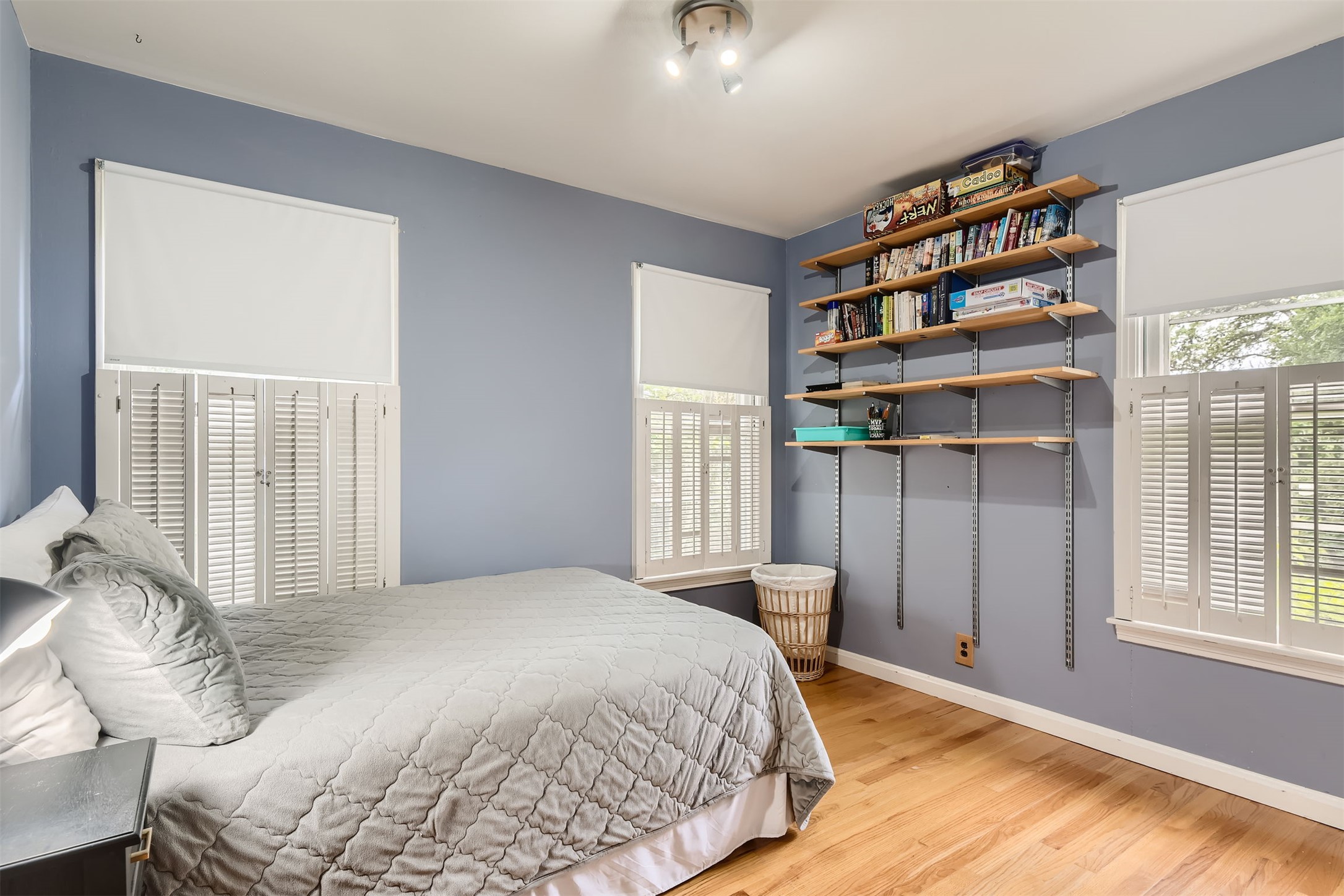 6804 Vine Street Austin, TX 78757 - Photo 10 of 15 a bedroom with a bed and a chandelier