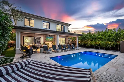 a view of a swimming pool with sitting area