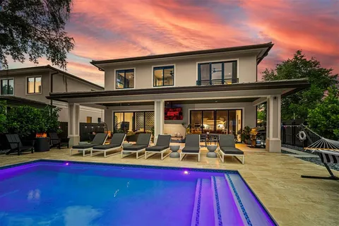 a view of a house with sitting area and furniture