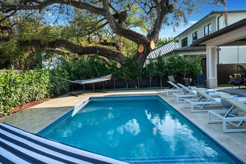 a view of a swimming pool with a patio