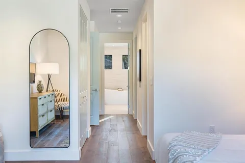 a view of a bathroom from a hallway